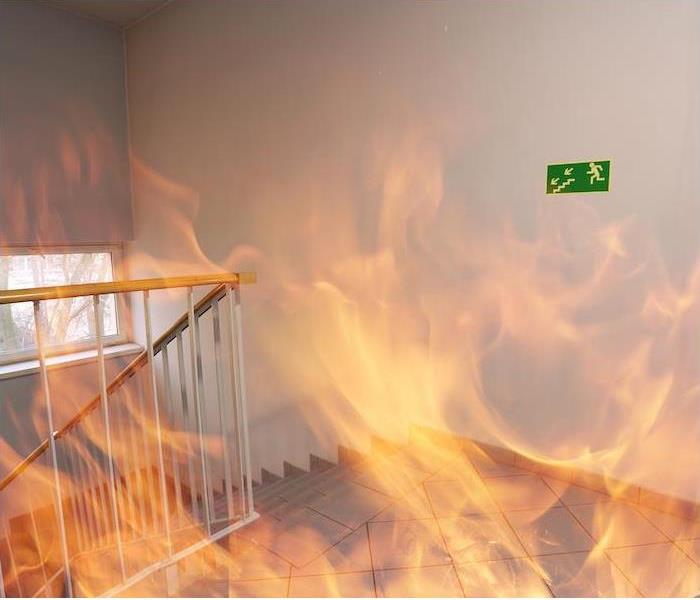 interior stairway in commercial building engulfed in flames