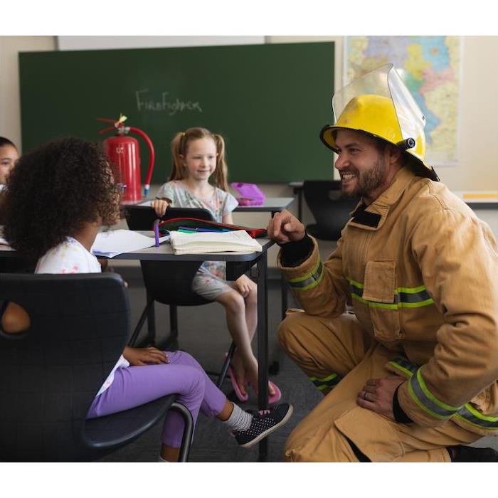 Fireman speaks with Elementary Students about Fire Safety